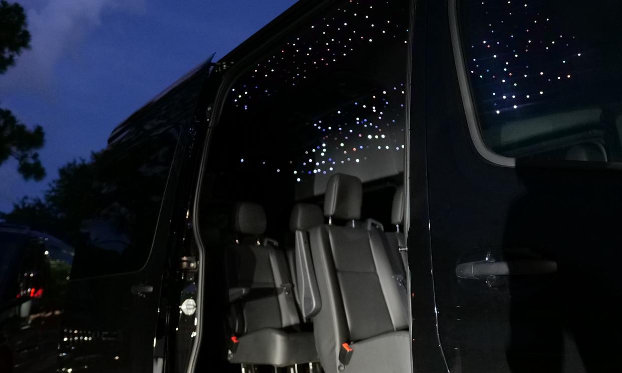 Blacked-out 10-passenger Mercedes-Benz Sprinter used for nights out and celebrations in Orlando